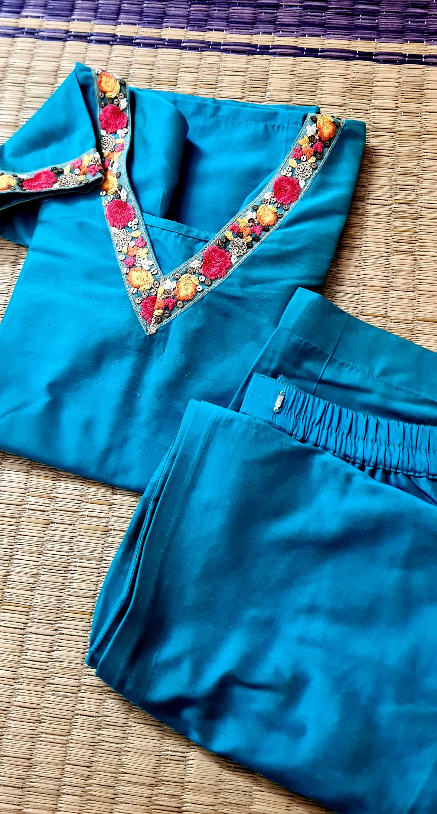 A Splash of Elegance: Blue Kurti and Bottom Set with Embroidered Neck and Sleeve Detail