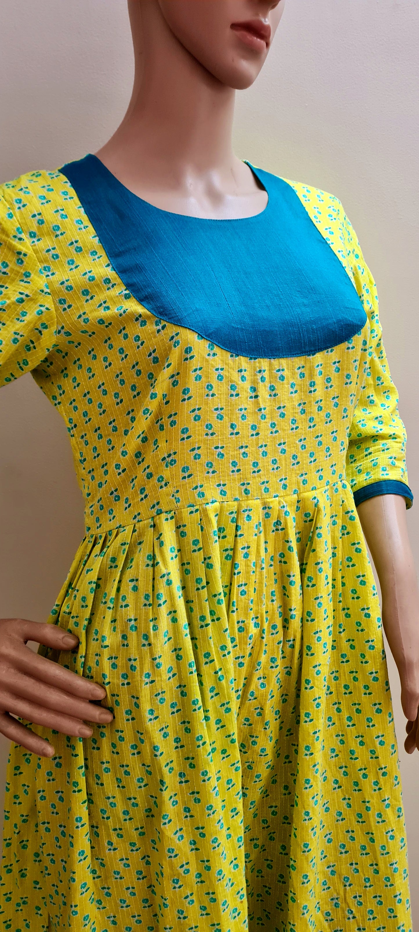 Lemon Yellow Cotton Frock with Peacock Green Yoke: Comfortably Simple and Eye-Catching