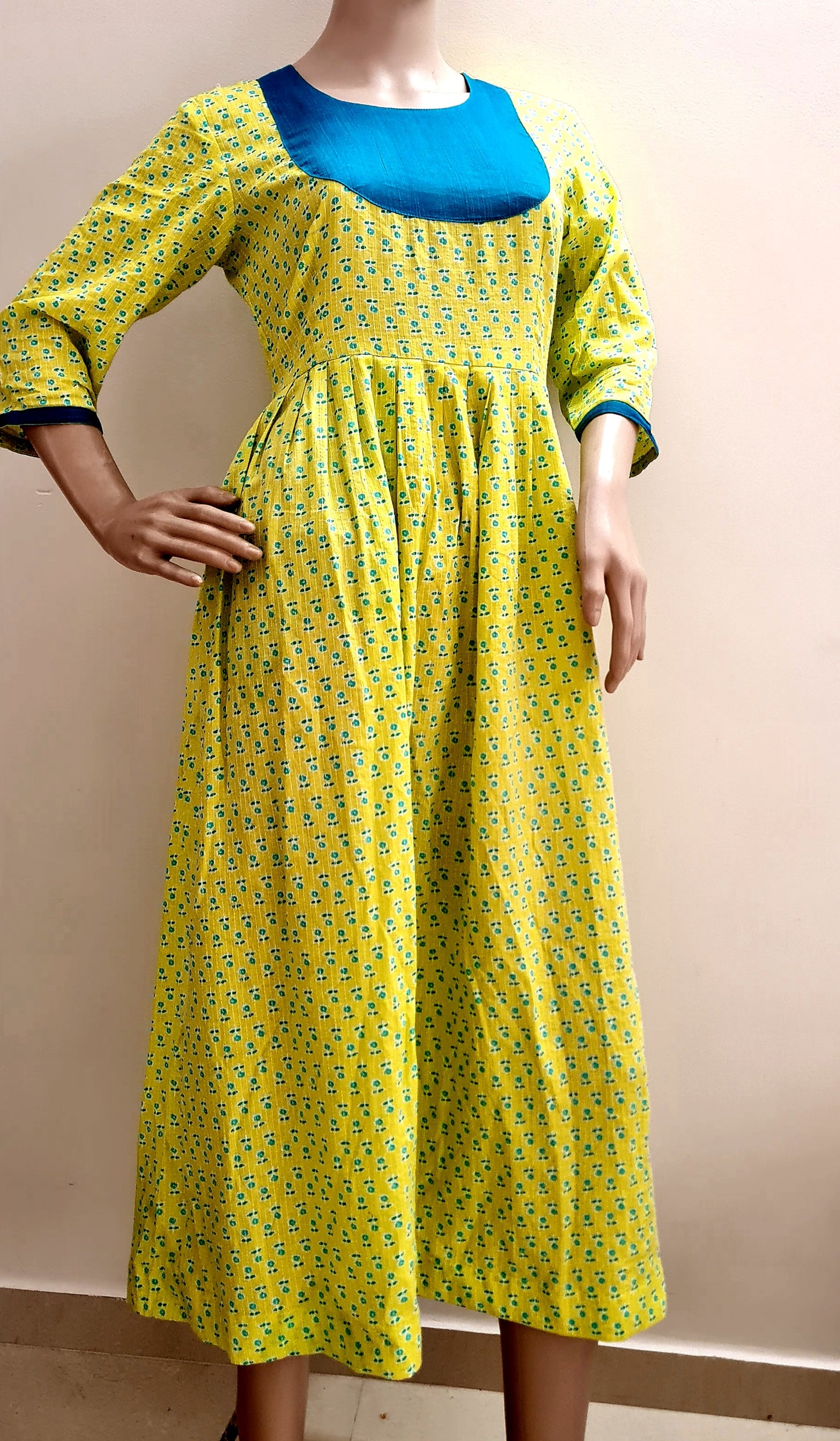 Lemon Yellow Cotton Frock with Peacock Green Yoke: Comfortably Simple and Eye-Catching