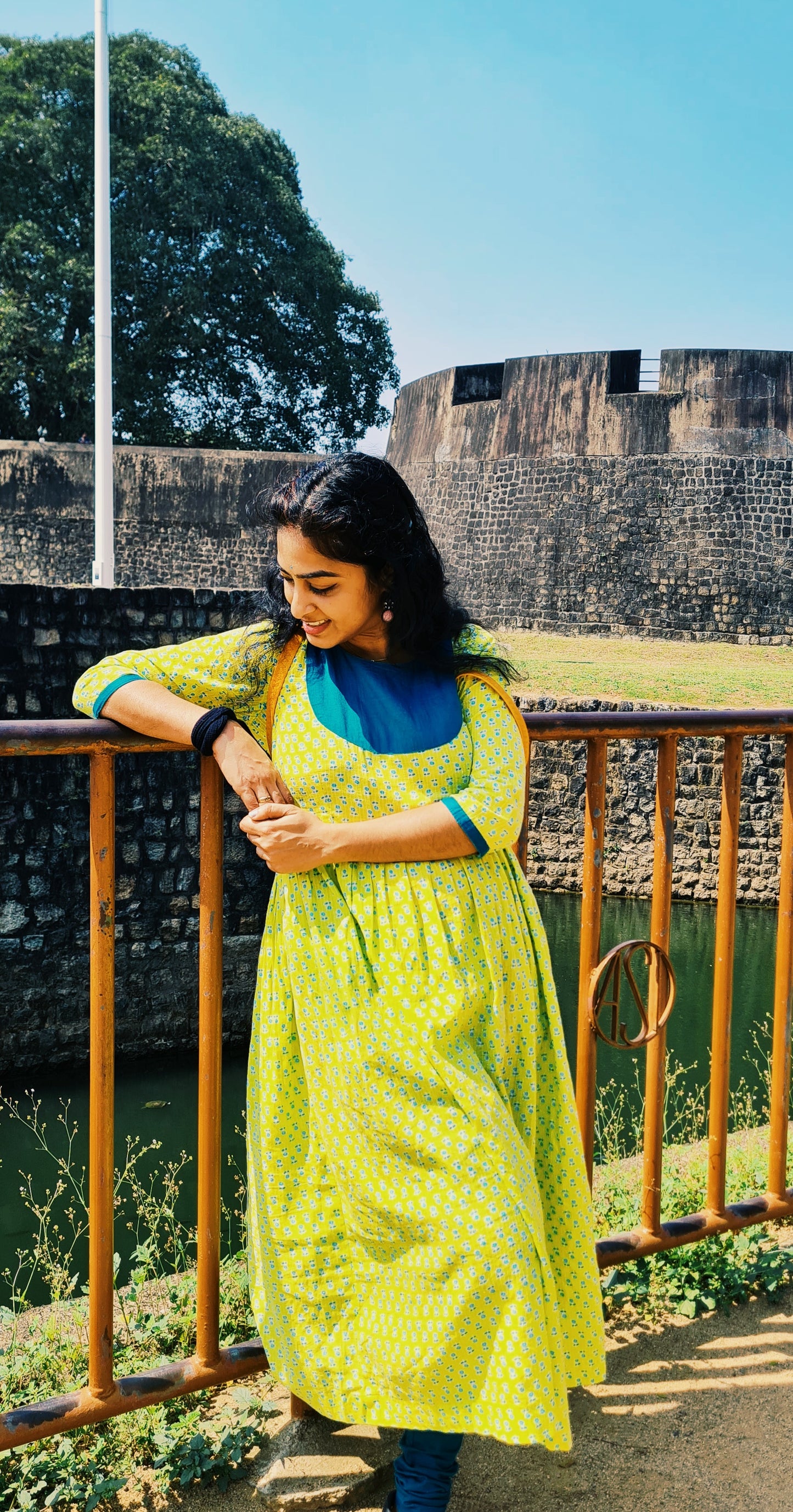 Lemon Yellow Cotton Frock with Peacock Green Yoke: Comfortably Simple and Eye-Catching